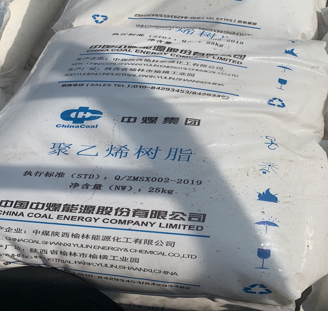 Outdoor-close-up-of-China-Coal-Group-polyethylene-raw-material-bag-with-production-standard-and-handling-symbols